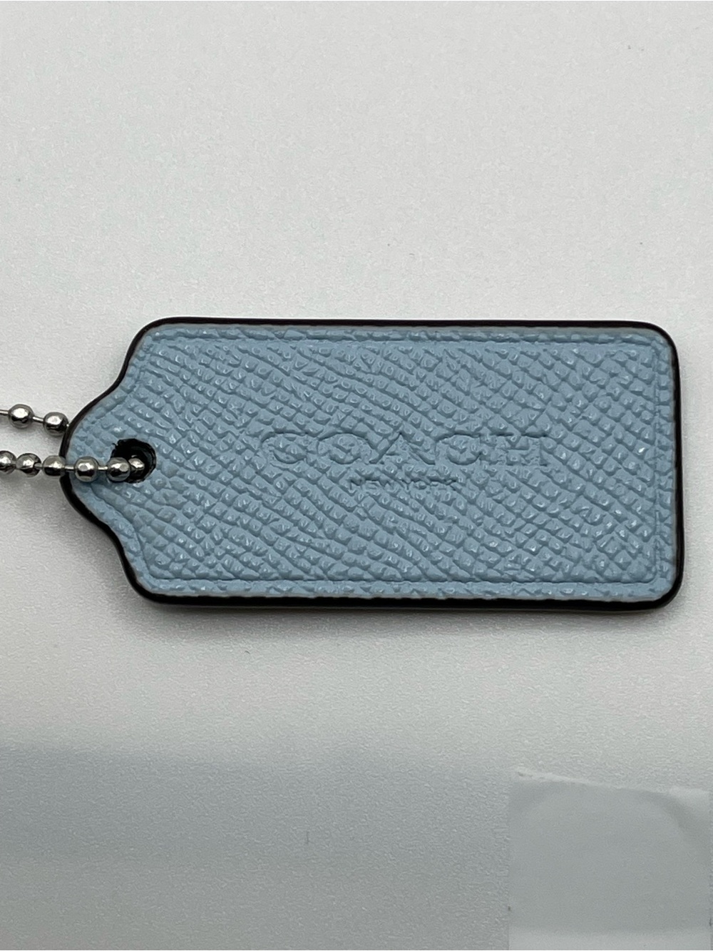 Coach Blue Pebbled Leather hangtag